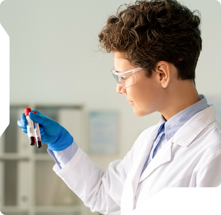 Researcher analyzing drug development data with predictive tools