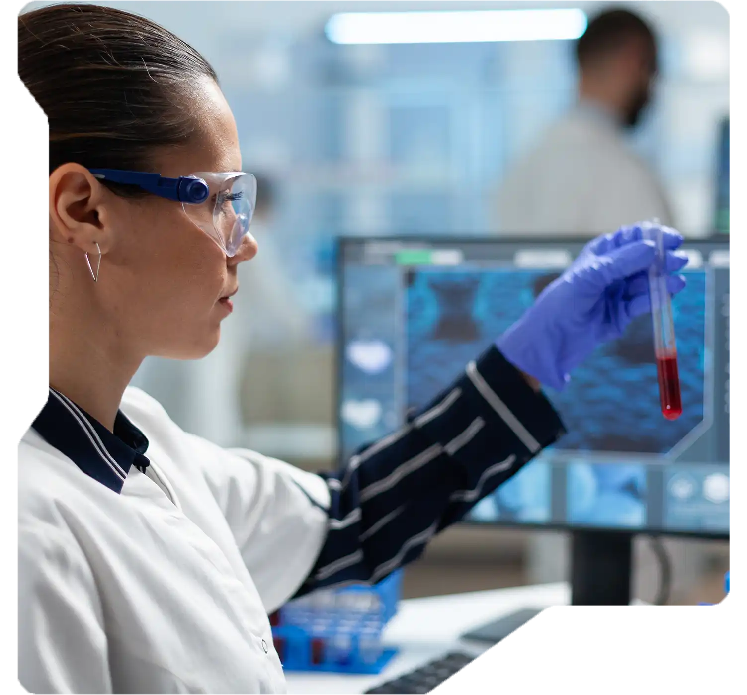 Researcher analyzing drug development data with predictive tools